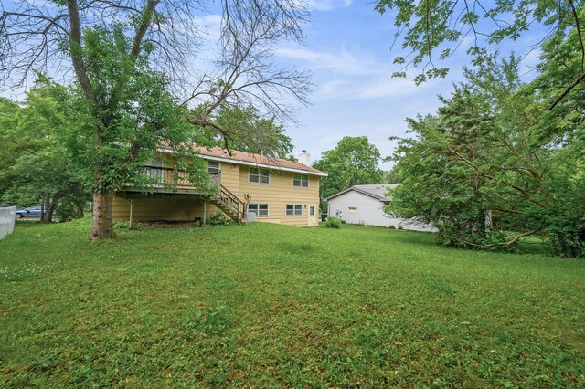 1813 Stinson Blvd, New Brighton, MN 55112 - view of grassy yard featuring stairs and a deck
