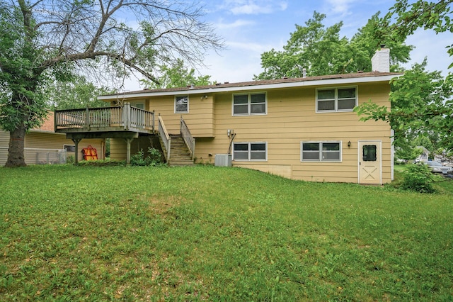 1813 Stinson Blvd, New Brighton, MN 55112 - rear view of property featuring a chimney, stairway, a deck, and a lawn