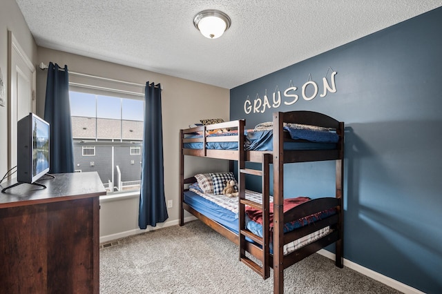 7363 146th Xing NW, Ramsey, MN 55303 - bedroom featuring a textured ceiling and carpet floors