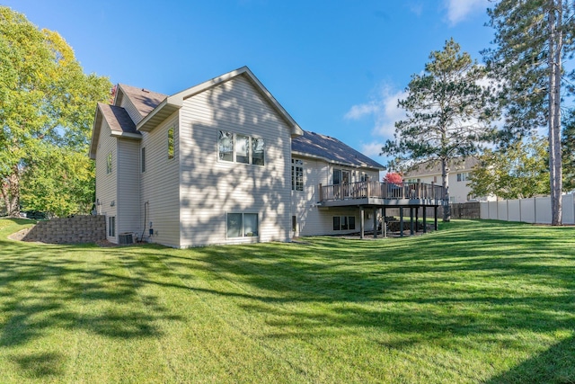 13023 Yellow Pine Cir NW, Coon Rapids, MN 55448 - back of property featuring a wooden deck and central air condition unit