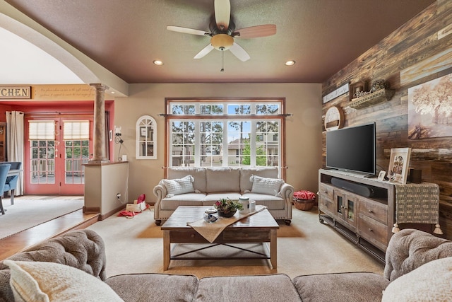 13023 Yellow Pine Cir NW, Coon Rapids, MN 55448 - living room featuring ornate columns, plenty of natural light, ceiling fan, arched walkways, and recessed lighting
