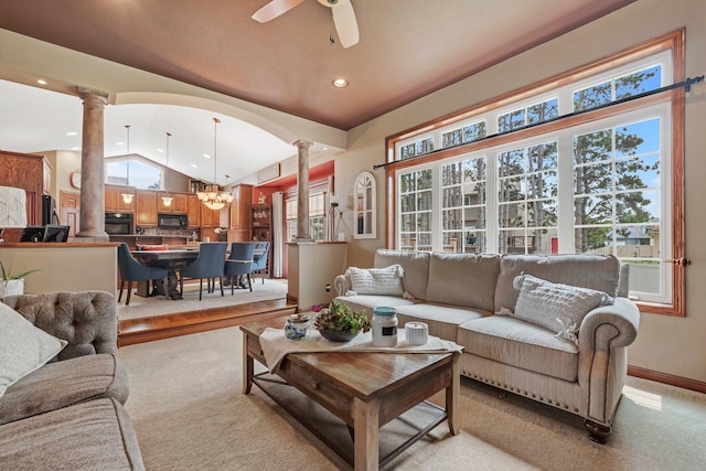 13023 Yellow Pine Cir NW, Coon Rapids, MN 55448 - living room with ornate columns, lofted ceiling, recessed lighting, a ceiling fan, and light colored carpet