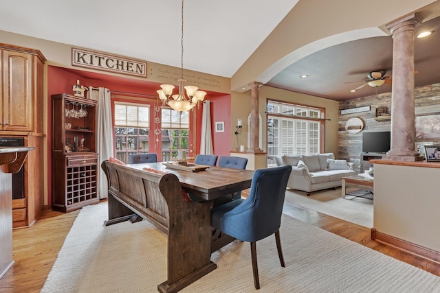 13023 Yellow Pine Cir NW, Coon Rapids, MN 55448 - dining room with ornate columns, a chandelier, arched walkways, light wood finished floors, and recessed lighting