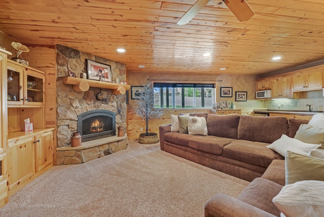 13023 Yellow Pine Cir NW, Coon Rapids, MN 55448 - living room with wood ceiling, a stone fireplace, carpet flooring, and recessed lighting