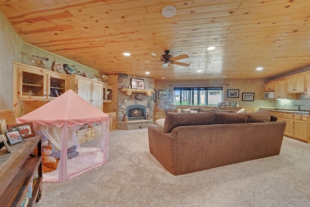 13023 Yellow Pine Cir NW, Coon Rapids, MN 55448 - living room featuring wood ceiling, light carpet, a fireplace, a ceiling fan, and recessed lighting