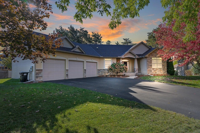 13023 Yellow Pine Cir NW, Coon Rapids, MN 55448 - view of front of house featuring stone siding, a garage, asphalt driveway, a front yard, and stucco siding