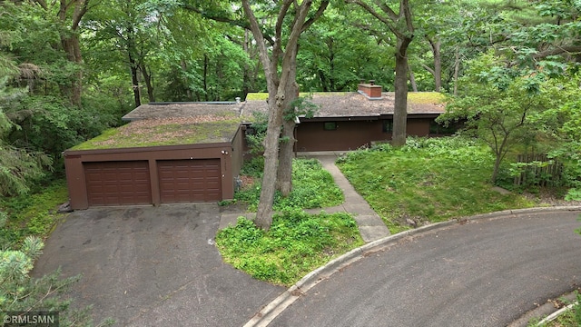 11209 Oak Ridge Ln W, Minnetonka, MN 55305 - view of front facade with a chimney