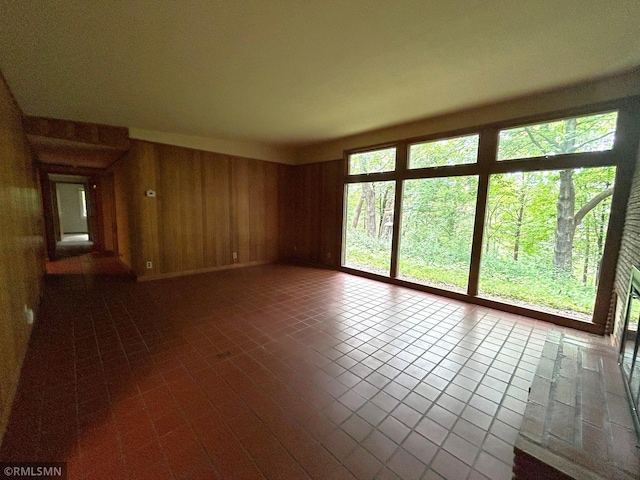 11209 Oak Ridge Ln W, Minnetonka, MN 55305 - unfurnished room featuring wooden walls and dark tile patterned flooring