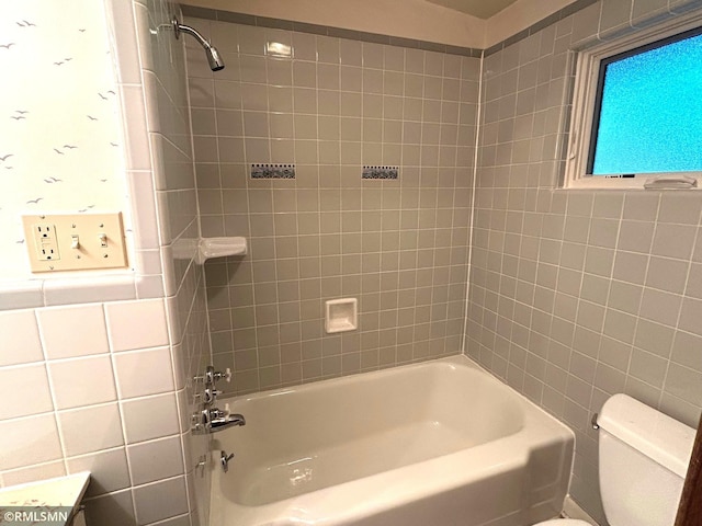 11209 Oak Ridge Ln W, Minnetonka, MN 55305 - bathroom featuring tile walls and washtub / shower combination