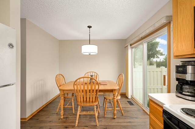 15524 Float Ln, Apple Valley, MN 55124 - dining room with dark wood finished floors and a textured ceiling