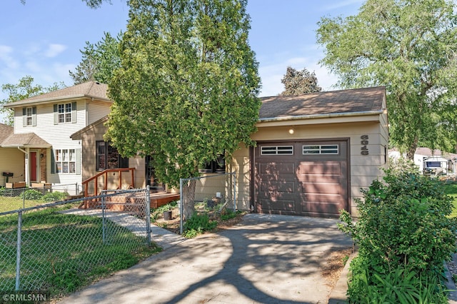 6316 15th Ave S, Richfield, MN 55423 - view of front facade with concrete driveway and a garage