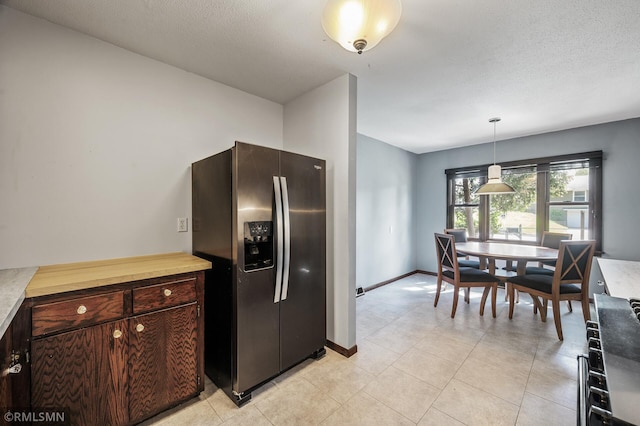6316 15th Ave S, Richfield, MN 55423 - kitchen with stainless steel refrigerator with ice dispenser, light countertops, dark brown cabinetry, pendant lighting, and a textured ceiling