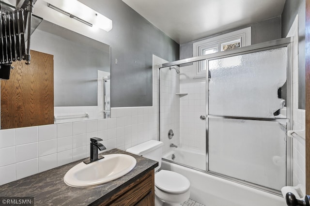 6316 15th Ave S, Richfield, MN 55423 - bathroom featuring toilet, vanity, and combined bath / shower with glass door