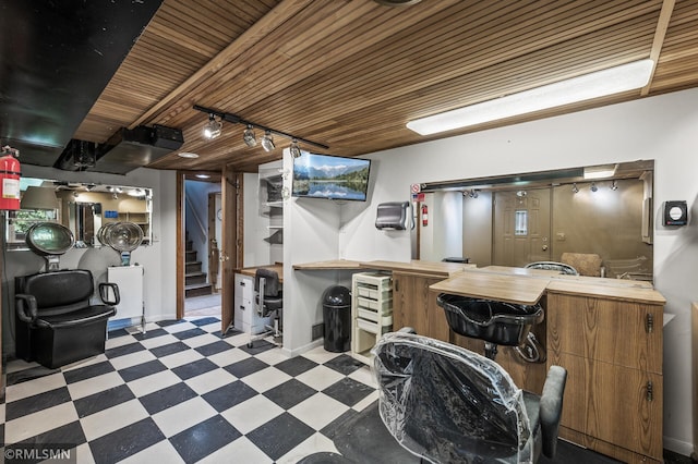 6316 15th Ave S, Richfield, MN 55423 - finished below grade area with tile patterned floors, wooden ceiling, rail lighting, stairway, and a community bar