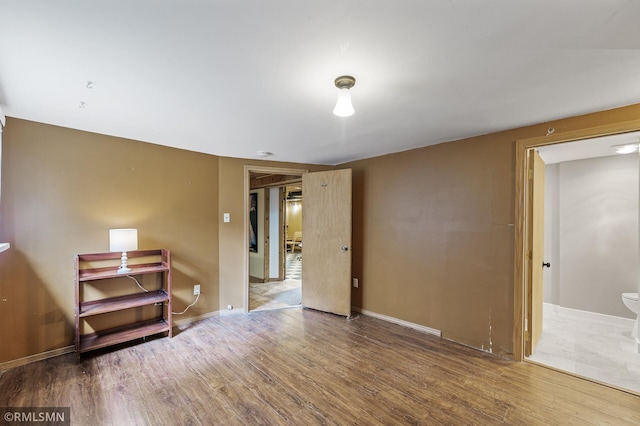 6316 15th Ave S, Richfield, MN 55423 - unfurnished room with wood finished floors, baseboards, and a smoke detector