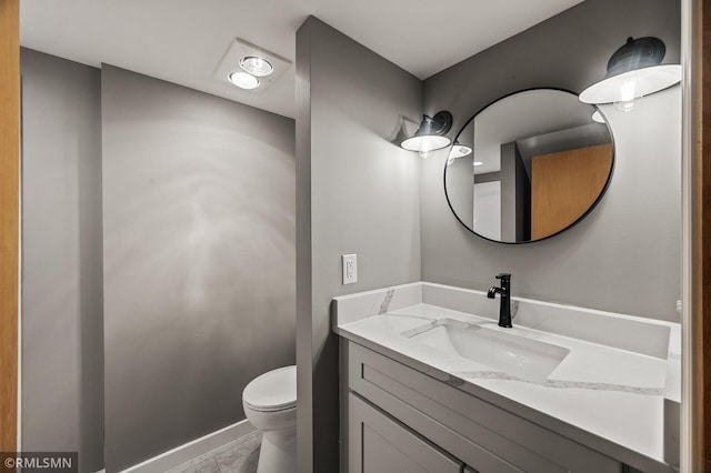 6316 15th Ave S, Richfield, MN 55423 - half bathroom featuring toilet, vanity, and baseboards
