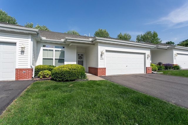 2230 Lower Afton Rd E, Saint Paul, MN 55119 - single story home featuring brick siding, asphalt driveway, a garage, and a front yard