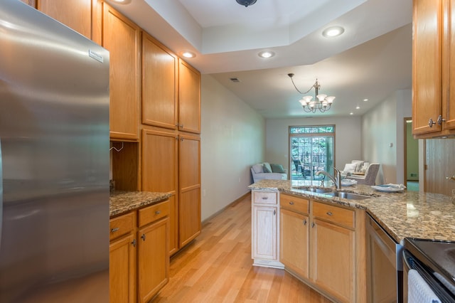 2230 Lower Afton Rd E, Saint Paul, MN 55119 - kitchen featuring stainless steel appliances, recessed lighting, a sink, light wood-style floors, and light stone counters