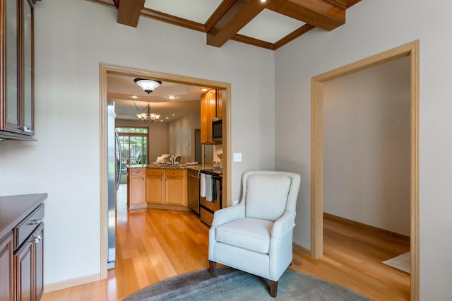 2230 Lower Afton Rd E, Saint Paul, MN 55119 - sitting room featuring light wood-type flooring, beamed ceiling, a chandelier, baseboards, and coffered ceiling