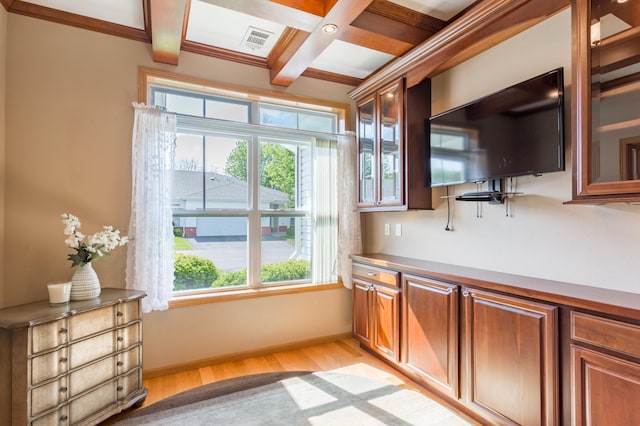 2230 Lower Afton Rd E, Saint Paul, MN 55119 - kitchen with light wood finished floors, coffered ceiling, beamed ceiling, glass insert cabinets, and brown cabinetry