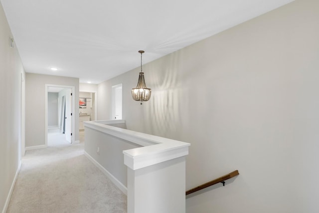 8633 Ambergate Dr, Victoria, MN 55386 - hallway with an upstairs landing, light carpet, recessed lighting, and a chandelier