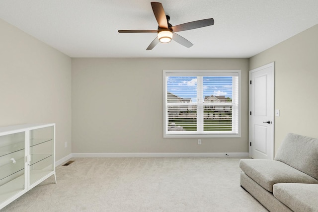 8633 Ambergate Dr, Victoria, MN 55386 - sitting room with light colored carpet and a ceiling fan