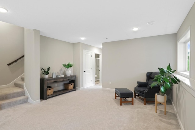 8633 Ambergate Dr, Victoria, MN 55386 - living area featuring stairway, light carpet, and recessed lighting