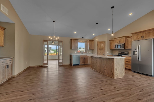 212 Woolgrass Way, Avon, MN 56310 - kitchen featuring stainless steel appliances, vaulted ceiling, a sink, wood finished floors, and light countertops
