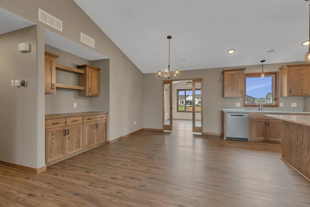 212 Woolgrass Way, Avon, MN 56310 - kitchen with stainless steel dishwasher, light countertops, light wood-style flooring, decorative light fixtures, and a chandelier