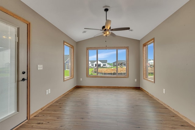 212 Woolgrass Way, Avon, MN 56310 - empty room with healthy amount of natural light, lofted ceiling, light wood-type flooring, ceiling fan, and baseboards