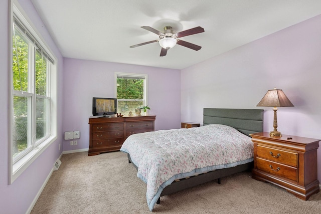 5110 Woodridge Rd, Minnetonka, MN 55345 - bedroom with light colored carpet, baseboards, and ceiling fan