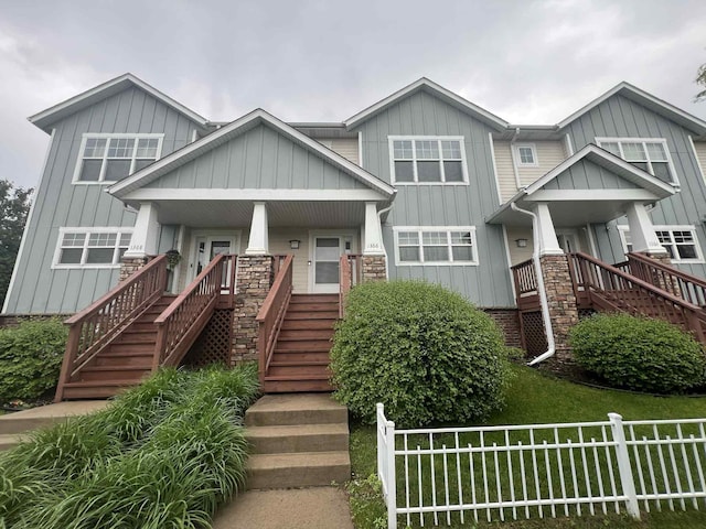 1366 Phalen Blvd, Saint Paul, MN 55106 - craftsman-style home featuring stairs, board and batten siding, and covered porch