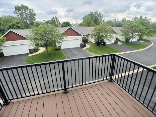 1366 Phalen Blvd, Saint Paul, MN 55106 - wooden terrace featuring a garage and a yard