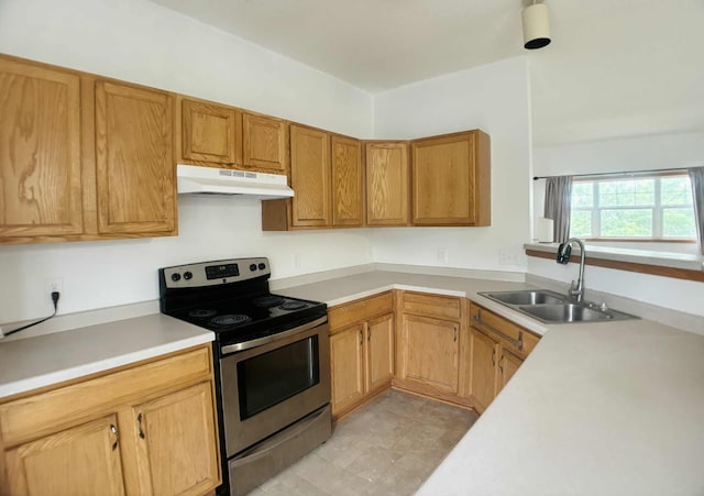 1366 Phalen Blvd, Saint Paul, MN 55106 - kitchen with stainless steel electric range, under cabinet range hood, a sink, and light countertops