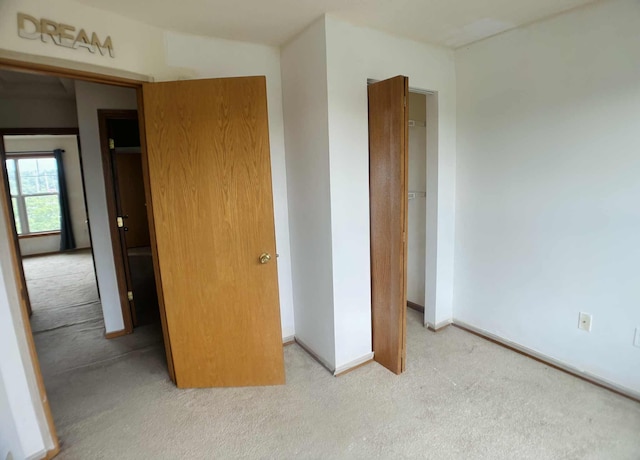 1366 Phalen Blvd, Saint Paul, MN 55106 - unfurnished bedroom featuring carpet, a closet, and baseboards