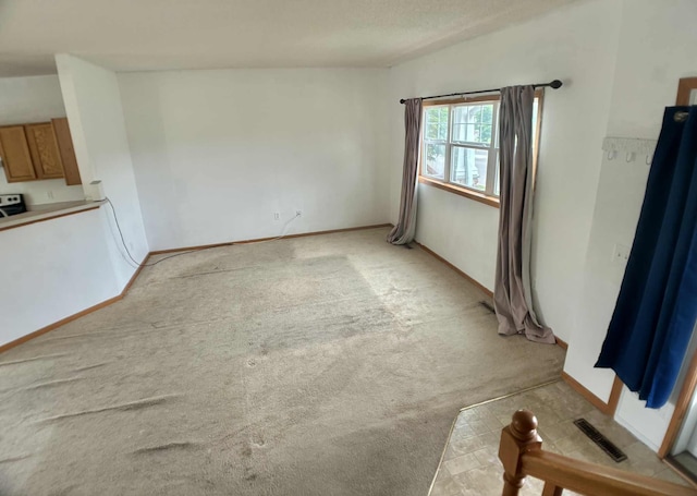 1366 Phalen Blvd, Saint Paul, MN 55106 - unfurnished living room featuring light colored carpet and baseboards