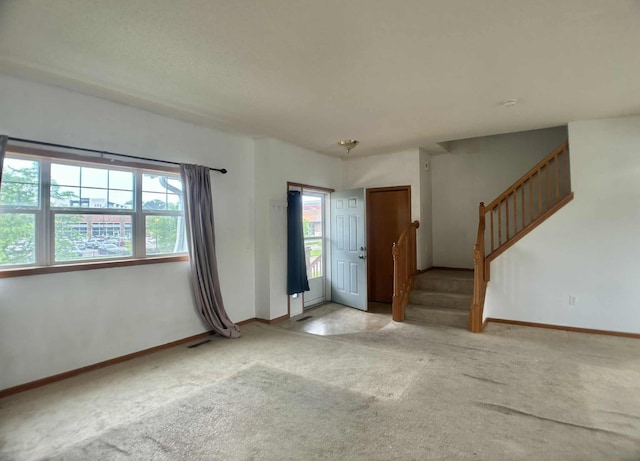 1366 Phalen Blvd, Saint Paul, MN 55106 - entrance foyer featuring stairway, carpet, and baseboards