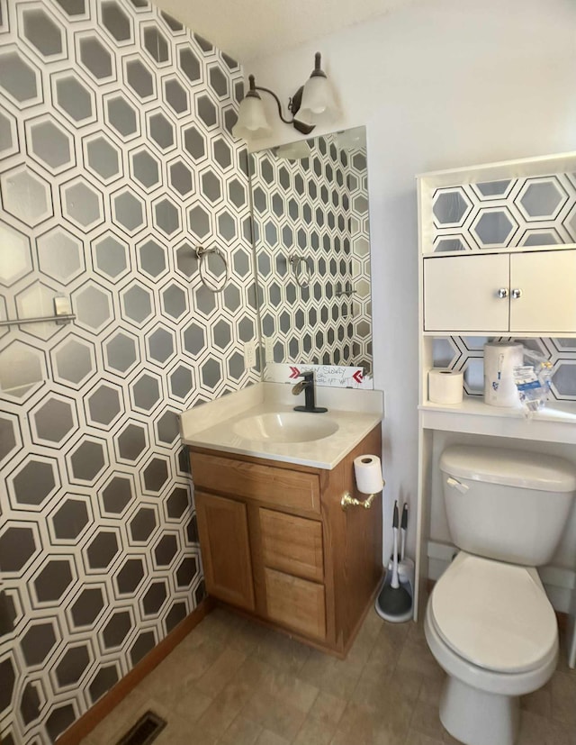 1366 Phalen Blvd, Saint Paul, MN 55106 - half bathroom featuring vanity and toilet
