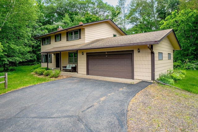 41502 Flink Ave, North Branch, MN 55056 - view of front facade featuring a garage, a front yard, roof with shingles, a chimney, and view of wooded area
