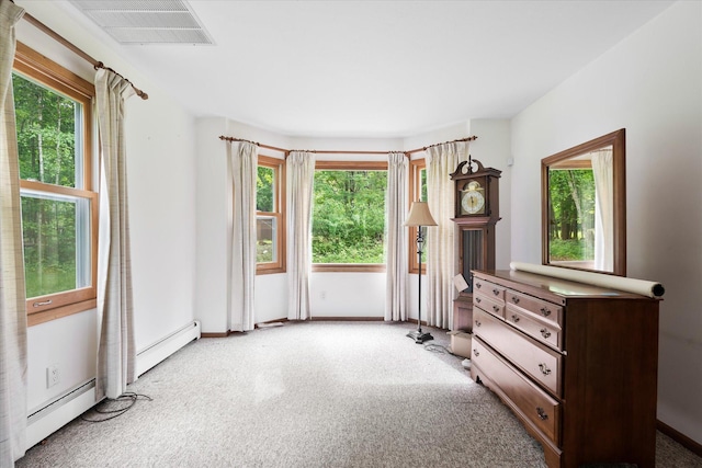 41502 Flink Ave, North Branch, MN 55056 - unfurnished bedroom with light carpet, baseboard heating, and a baseboard heating unit