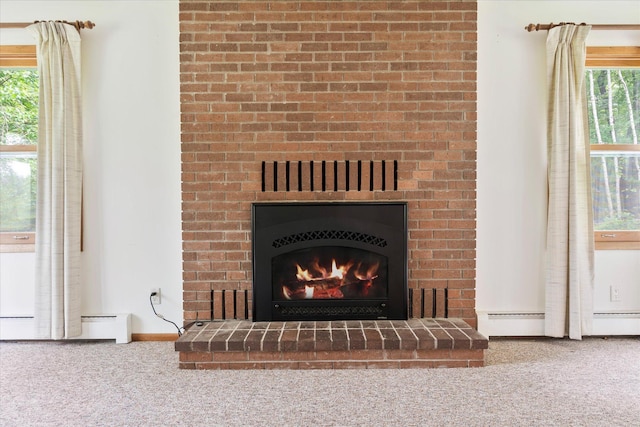 41502 Flink Ave, North Branch, MN 55056 - detailed view of carpet flooring, a fireplace, baseboard heating, and a baseboard radiator