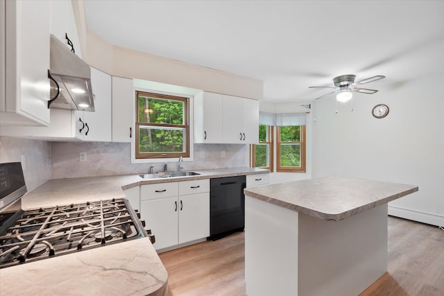 41502 Flink Ave, North Branch, MN 55056 - kitchen featuring black dishwasher, stainless steel gas stove, exhaust hood, and light wood finished floors