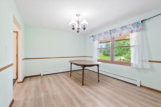 41502 Flink Ave, North Branch, MN 55056 - dining area featuring a baseboard radiator, a chandelier, and light wood-style flooring