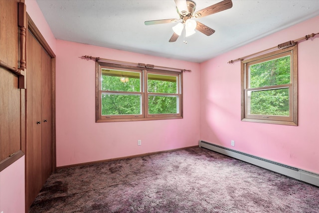 41502 Flink Ave, North Branch, MN 55056 - unfurnished bedroom with baseboard heating, carpet floors, a closet, and a ceiling fan