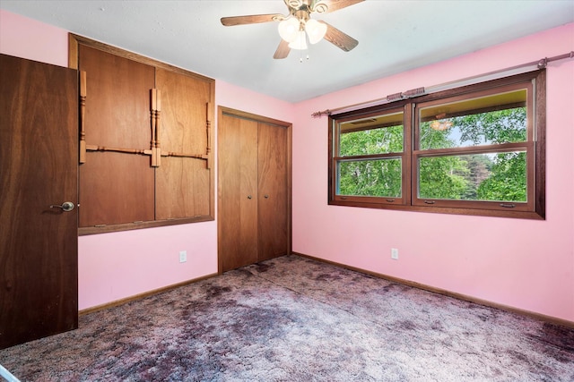 41502 Flink Ave, North Branch, MN 55056 - unfurnished bedroom featuring carpet, multiple windows, a closet, and ceiling fan