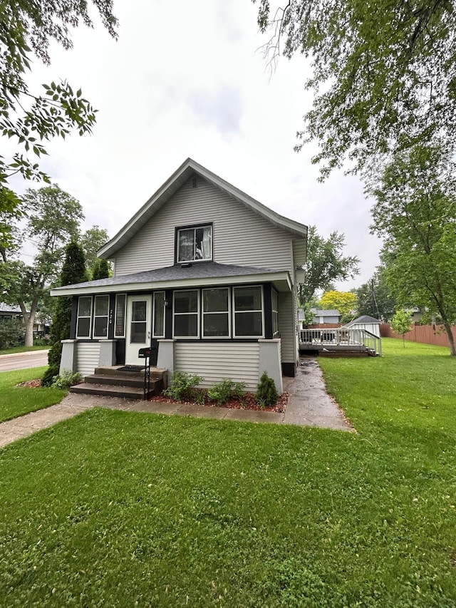 720 5th Ave N, Sauk Rapids, MN 56379 - back of house featuring a deck and a sunroom