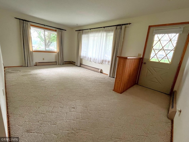 1277 Shakopee Ave E, Shakopee, MN 55379 - empty room featuring light colored carpet and baseboard heating