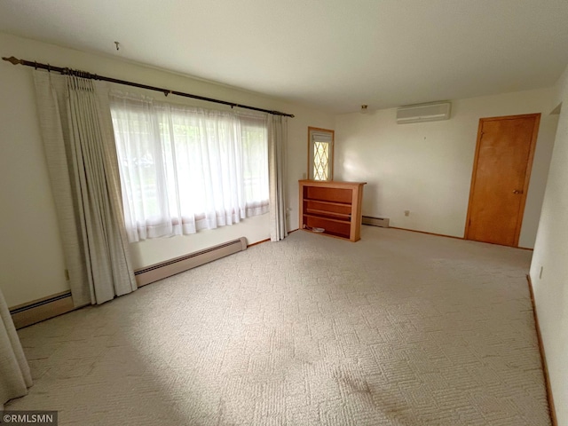 1277 Shakopee Ave E, Shakopee, MN 55379 - spare room featuring a wall unit AC, a baseboard heating unit, and light colored carpet