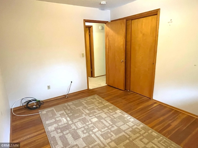 1277 Shakopee Ave E, Shakopee, MN 55379 - unfurnished bedroom with wood finished floors and a closet