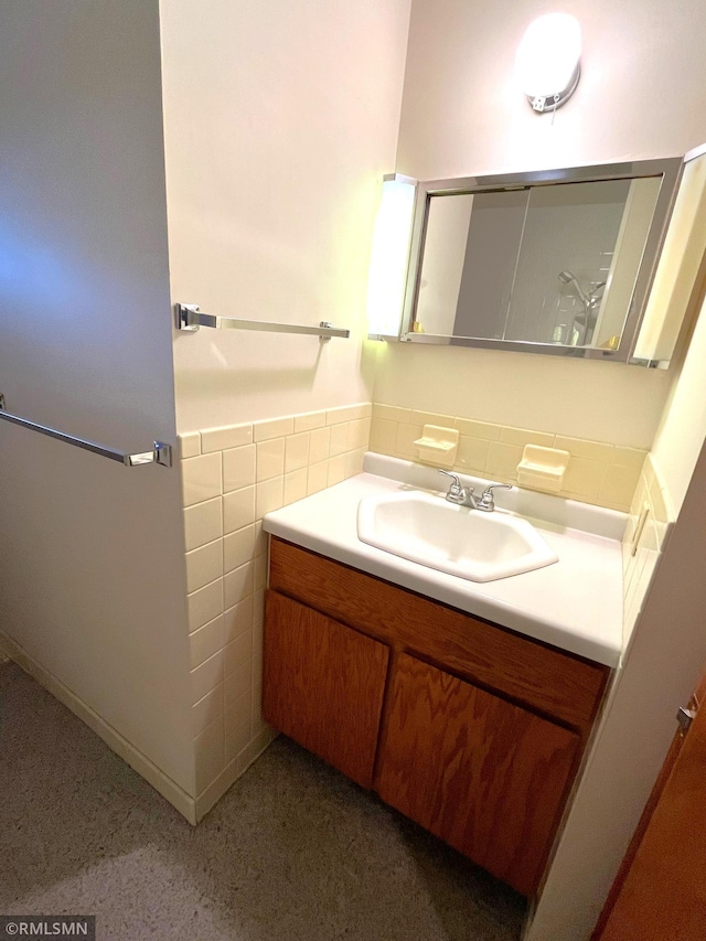 1277 Shakopee Ave E, Shakopee, MN 55379 - bathroom with vanity, tile walls, and wainscoting